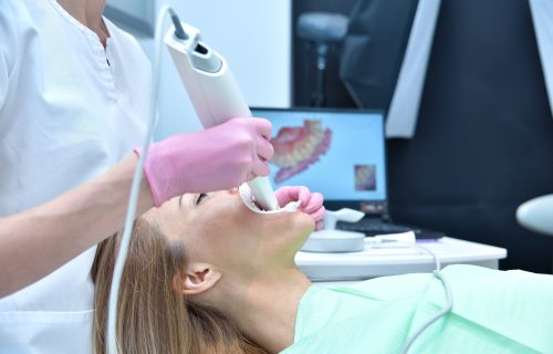Dentist,Scaning,Patient's,Teeth,With,Dental,3d,Scanner,And,Screen